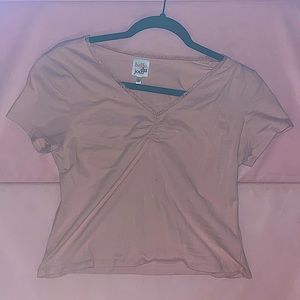 pink crop top with a lace trim.